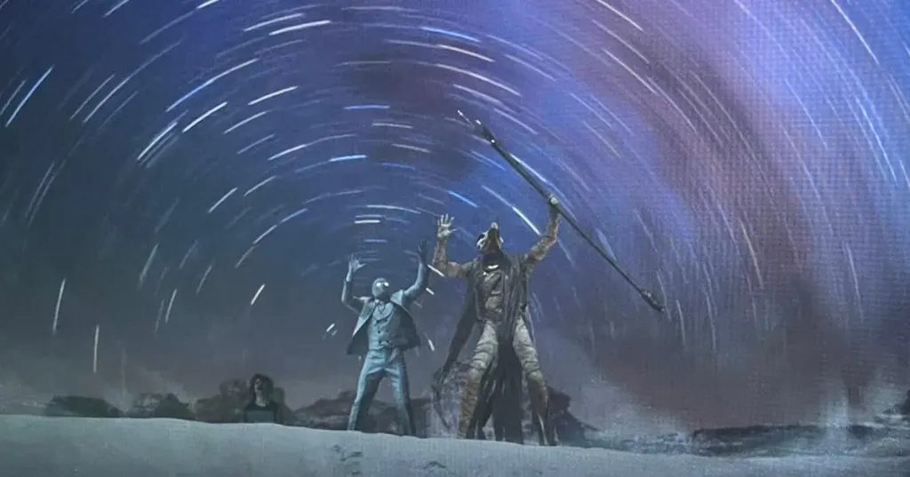 Moon Knight scene with star trails circling above two figures in the desert